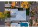 An aerial view of the backyard, lush lawn, and sparkling pool at 4527 N 12Th Ave, Phoenix, AZ 85013