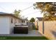 Backyard featuring a hot tub, artificial turf, and brick wall providing privacy at 4527 N 12Th Ave, Phoenix, AZ 85013