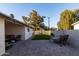 Inviting backyard boasts a covered patio, lush artificial turf, and a well-manicured landscape at 4527 N 12Th Ave, Phoenix, AZ 85013