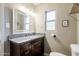 Bathroom featuring granite countertops, a decorative mirror, and modern fixtures at 4527 N 12Th Ave, Phoenix, AZ 85013