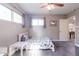 Bright bedroom with a ceiling fan, large windows, and a cute, comfortable bed with a dinosaur theme at 4527 N 12Th Ave, Phoenix, AZ 85013