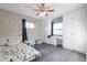 Well-lit bedroom featuring built-in storage, a small desk, and a comfortable bed at 4527 N 12Th Ave, Phoenix, AZ 85013