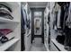 A generously sized walk-in closet offers ample storage space with built-in shelving, drawers, and hanging rods at 4527 N 12Th Ave, Phoenix, AZ 85013