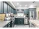 The kitchen boasts dark cabinets, a stainless steel refrigerator, and granite countertops with stainless appliances at 4527 N 12Th Ave, Phoenix, AZ 85013
