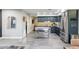 A spacious kitchen features stainless steel appliances and an island with a metal frame and open shelves for storage at 4527 N 12Th Ave, Phoenix, AZ 85013