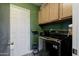 Functional laundry room featuring modern LG washer, cabinets, and shelving for efficient organization at 4527 N 12Th Ave, Phoenix, AZ 85013
