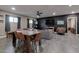 Open-concept living and dining area boasts modern furnishings, a ceiling fan, and lots of natural light at 4527 N 12Th Ave, Phoenix, AZ 85013