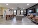 Open-concept living and dining area boasts modern furnishings, a ceiling fan, and lots of natural light at 4527 N 12Th Ave, Phoenix, AZ 85013