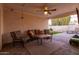 Covered patio is furnished with stylish seating, ceiling fan, and string lights, ideal for outdoor living at 4527 N 12Th Ave, Phoenix, AZ 85013