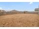 Large blank canvas for a backyard with block fence and mountain views at 4795 W Hunter Trl, San Tan Valley, AZ 85144