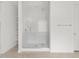 Modern bathroom with glass-enclosed shower and built-in shelving at 4795 W Hunter Trl, San Tan Valley, AZ 85144