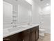 Bathroom with double sinks, a wooden cabinet and a walk-in shower at 4795 W Hunter Trl, San Tan Valley, AZ 85144