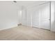 Bright, airy bedroom with carpet, closet with sliding doors, and a view into an open doorway at 4795 W Hunter Trl, San Tan Valley, AZ 85144
