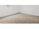 A bright bedroom features neutral carpet and white walls at 4795 W Hunter Trl, San Tan Valley, AZ 85144