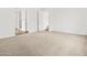 A bedroom with neutral carpet and an ensuite bathroom at 4795 W Hunter Trl, San Tan Valley, AZ 85144