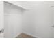 Walk-in closet with shelves and neutral carpet at 4795 W Hunter Trl, San Tan Valley, AZ 85144