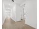 Bright hallway features neutral tile, leading to rooms and other spaces at 4795 W Hunter Trl, San Tan Valley, AZ 85144