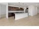 Stylish kitchen boasts granite countertops, dark wood cabinetry, and stainless steel appliances at 4795 W Hunter Trl, San Tan Valley, AZ 85144