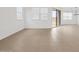 Bright living room with tile floor, white walls and sliding glass doors at 4795 W Hunter Trl, San Tan Valley, AZ 85144