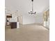 Bright, open-concept living space with kitchen island and access to the patio at 4795 W Hunter Trl, San Tan Valley, AZ 85144