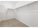The walk-in closet offers ample storage space with shelving and hanging rods at 4795 W Hunter Trl, San Tan Valley, AZ 85144