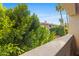 Balcony view showcasing lush greenery and the building at 5104 N 32Nd St # 311, Phoenix, AZ 85018