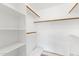 This linen closet has white shelves and dowels for storage at 5104 N 32Nd St # 311, Phoenix, AZ 85018