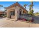 Meridian Condominiums entrance showcases desert landscaping and stucco architecture, providing a welcoming gateway to the community at 5104 N 32Nd St # 311, Phoenix, AZ 85018