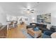 Spacious, light-filled living room with hardwood floors, modern decor, and an open floor plan at 5104 N 32Nd St # 311, Phoenix, AZ 85018