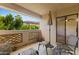 Charming patio featuring an umbrella, lounge chairs, with a ceiling fan and decorative privacy screen at 5104 N 32Nd St # 311, Phoenix, AZ 85018