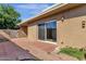 A brick patio features sliding glass door entrance with manicured landscaping at 5316 S Palm Dr, Tempe, AZ 85283