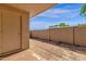 A serene backyard featuring brick pavers, block walls, and a private entrance at 5316 S Palm Dr, Tempe, AZ 85283