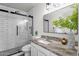 A sleek bathroom featuring subway tiles in the shower, and stylish marble countertops at 5316 S Palm Dr, Tempe, AZ 85283