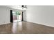 Spacious bedroom with wood-look flooring and sliding glass doors to the backyard at 5316 S Palm Dr, Tempe, AZ 85283