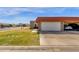 Single-story home with a red tile roof and a wide driveway offers ample parking at 5316 S Palm Dr, Tempe, AZ 85283