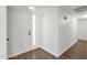 Bright foyer with neutral paint, wood-look floors, and transom window for natural light at 5316 S Palm Dr, Tempe, AZ 85283