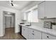 Clean and modern kitchen with white cabinets and stainless steel appliances at 5316 S Palm Dr, Tempe, AZ 85283