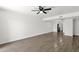 Bright living room with wood-look flooring, ceiling fan, and neutral paint at 5316 S Palm Dr, Tempe, AZ 85283