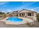 Gorgeous in-ground backyard pool with ample lounge seating and well-maintained desert landscaping at 628 N El Dorado Dr, Gilbert, AZ 85233