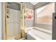 Bright bathroom with a soaking tub, shower, and large window for natural light at 628 N El Dorado Dr, Gilbert, AZ 85233