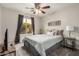 Comfortable bedroom with a ceiling fan, carpet flooring, and natural light at 628 N El Dorado Dr, Gilbert, AZ 85233