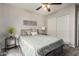 Comfortable bedroom with a ceiling fan, carpet flooring, and natural light at 628 N El Dorado Dr, Gilbert, AZ 85233