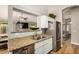 The kitchen features stainless steel appliances, granite countertops, and a view into the living room at 628 N El Dorado Dr, Gilbert, AZ 85233