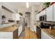 Bright kitchen features stainless steel appliances, granite countertops, and light wood flooring at 628 N El Dorado Dr, Gilbert, AZ 85233
