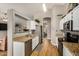 Bright kitchen features stainless steel appliances, granite countertops, and light wood flooring at 628 N El Dorado Dr, Gilbert, AZ 85233