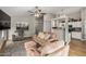 Inviting living room with modern decor, plush seating, and an open view into the kitchen, ideal for entertaining and relaxation at 628 N El Dorado Dr, Gilbert, AZ 85233