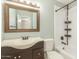 A modern bathroom features updated vanity with a shower/tub combo at 6411 S El Camino Dr, Tempe, AZ 85283