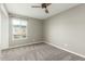This cozy bedroom features neutral paint, carpet and a ceiling fan at 6411 S El Camino Dr, Tempe, AZ 85283