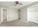 A comfortable bedroom features neutral colors and an attached bathroom at 6411 S El Camino Dr, Tempe, AZ 85283