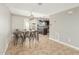 Dining area features a large table, tile flooring, and access to the kitchen and backyard at 6411 S El Camino Dr, Tempe, AZ 85283